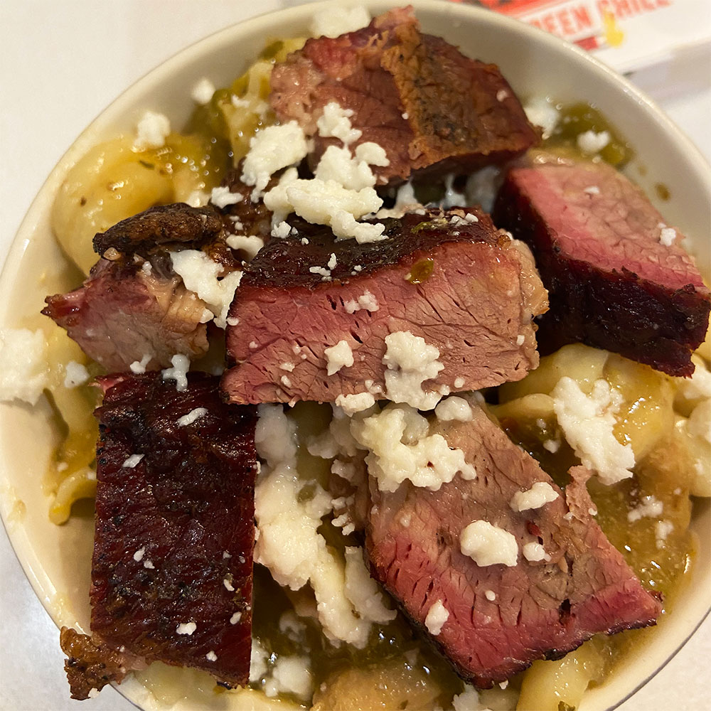 stinkin' good green chile mac and queso with smoked beef brisket
